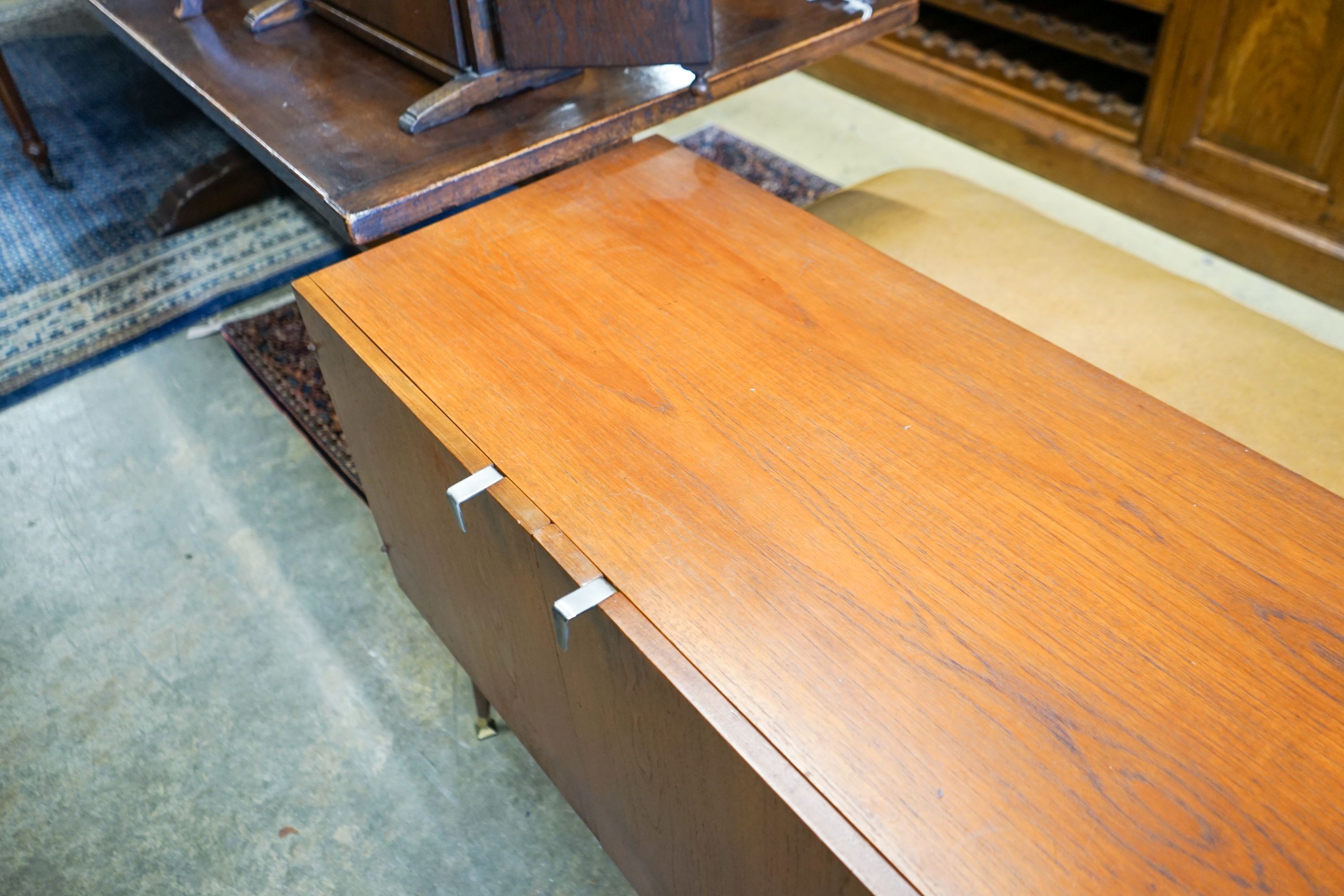 A mid 20th century Stag teak sideboard, length 137cm, depth 48cm, height 73cm